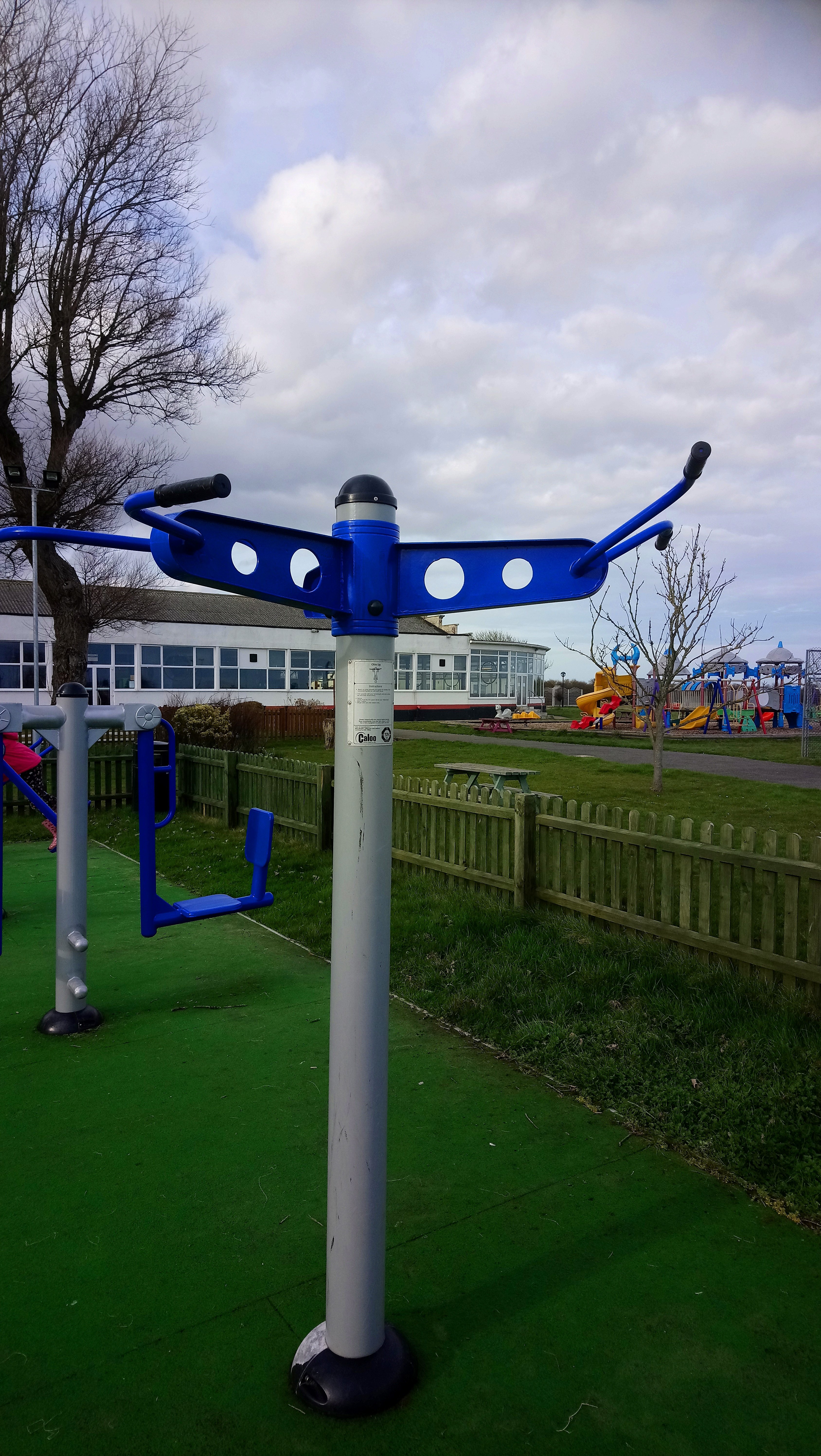 an image of gym equipment in an outside park where the aim is to lift your body off the ground and to raise your chin